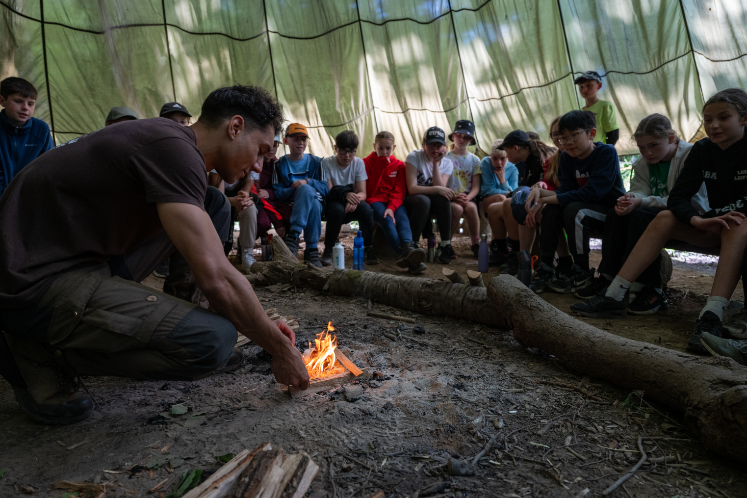 bushcraft instructor lighting fire
