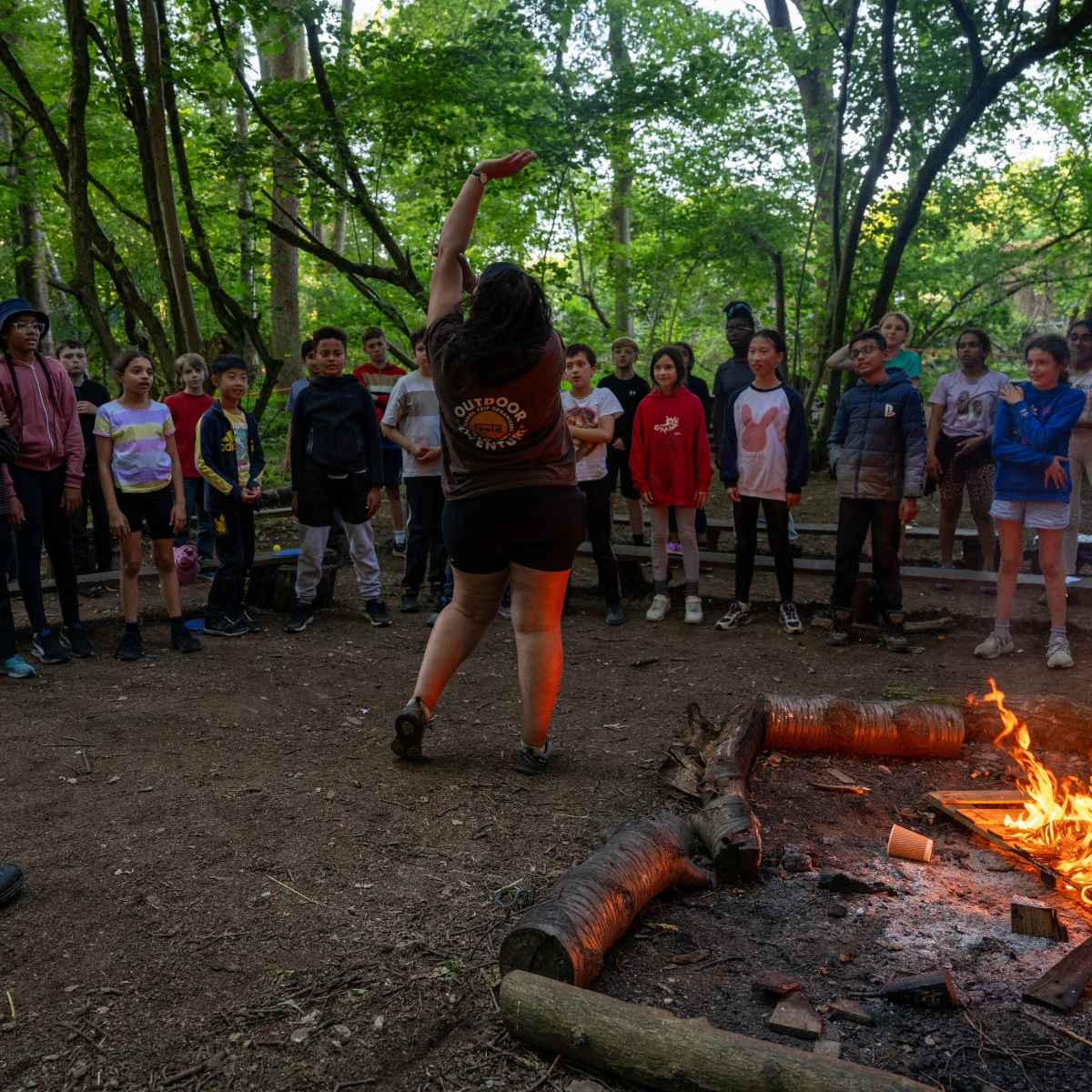 children taking part in evening games on residential trip