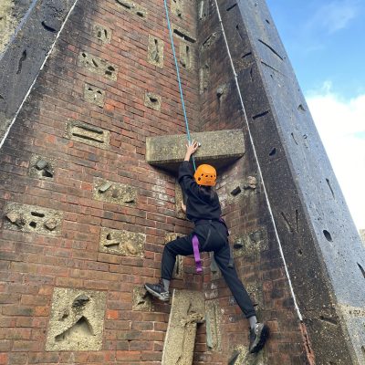 Girl climbing on a Rootd School Residential Adventure