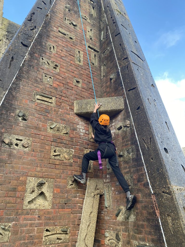 Girl climbing on a Rootd School Residential Adventure