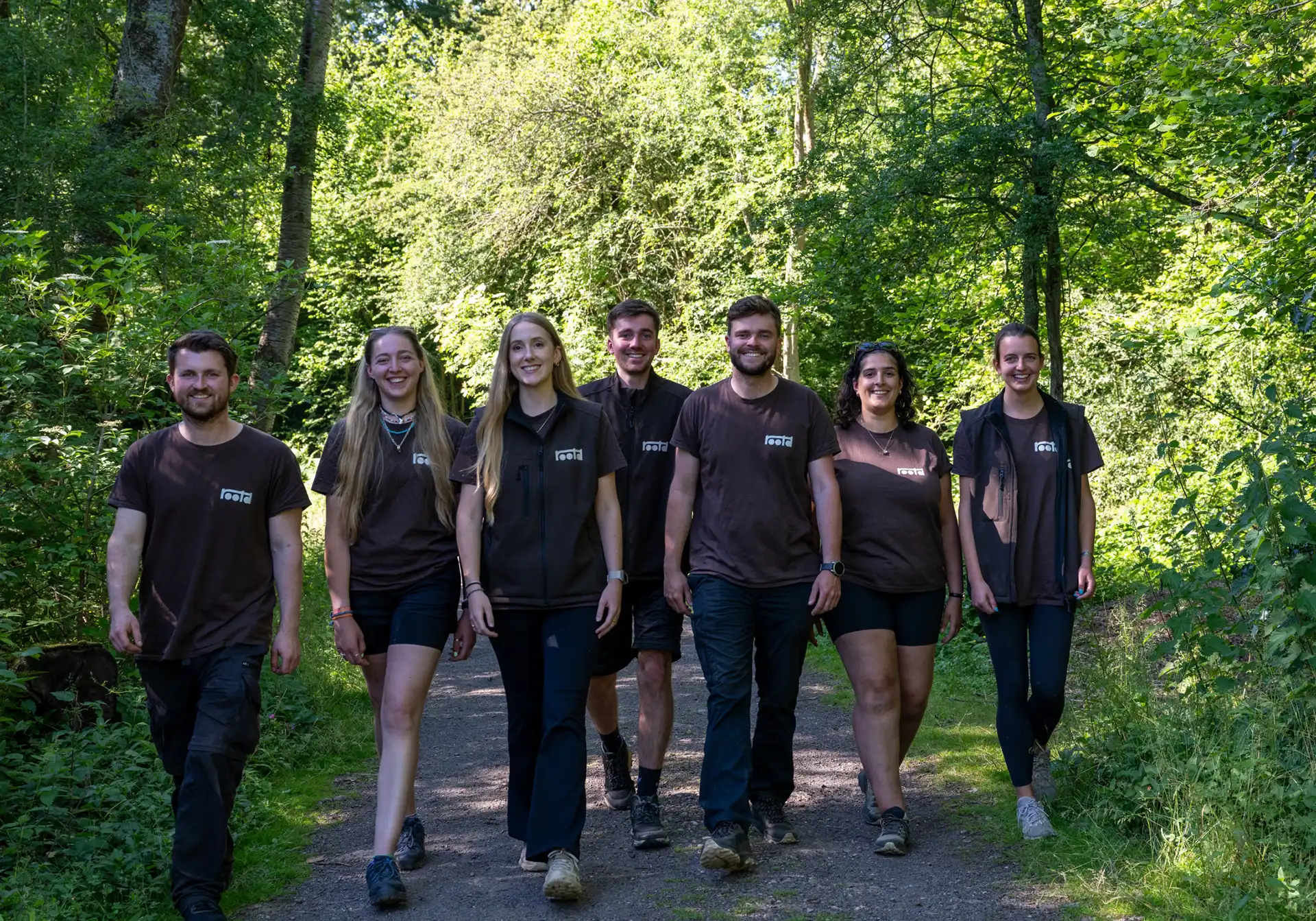The Rootd team walking through the woods