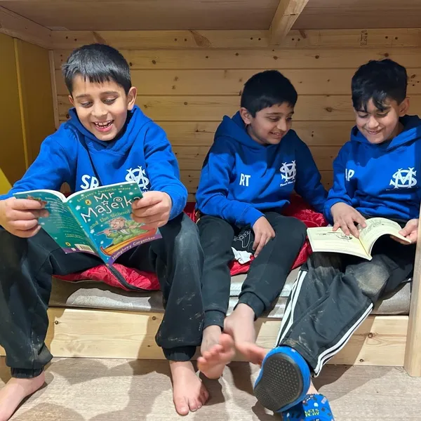 boys reading books in pods