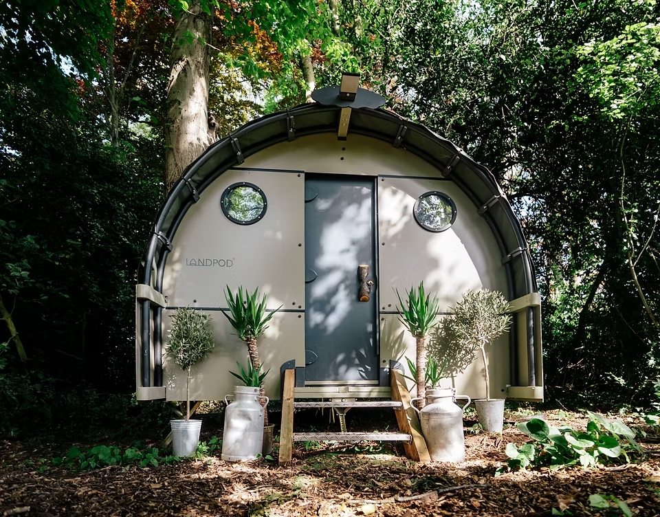 Outside of a Rootd Landpod in the woods